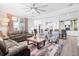 Open-concept living room with modern ceiling fan and hardwood flooring at 451 Spectrum Rd, Summerville, SC 29486