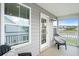 Relaxing patio with comfortable chairs and a scenic view of the pond at 451 Spectrum Rd, Summerville, SC 29486