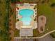 Aerial view of a community pool and playground area with lush landscaping and parking, great for families to enjoy at 451 Spectrum Rd, Summerville, SC 29486