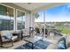 Cozy screened porch with comfortable seating, perfect for relaxation and entertaining at 451 Spectrum Rd, Summerville, SC 29486