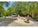 Backyard with a hammock, fire pit and chairs at 4932 N Rhett Ave, North Charleston, SC 29405