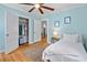 Charming bedroom features light blue walls, wood floors, and a ceiling fan at 4932 N Rhett Ave, North Charleston, SC 29405