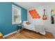 Bright bedroom with guitars hanging on wall at 4932 N Rhett Ave, North Charleston, SC 29405