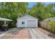 Detached garage with driveway and outdoor patio area; enhanced outdoor living at 4932 N Rhett Ave, North Charleston, SC 29405