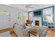 Bright living room features a cozy fireplace, hardwood floors, and ample natural light at 4932 N Rhett Ave, North Charleston, SC 29405