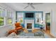 Inviting living room showcasing a fireplace, hardwood floors, and large windows for abundant light at 4932 N Rhett Ave, North Charleston, SC 29405