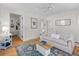 Well-lit living room with hardwood floors, comfortable seating, and stylish decor at 4932 N Rhett Ave, North Charleston, SC 29405