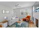Bright living room featuring hardwood floors, a cozy sofa, and an inviting atmosphere at 4932 N Rhett Ave, North Charleston, SC 29405