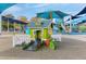 A charming playhouse with a slide and fenced area, set in a vibrant playground at 4932 N Rhett Ave, North Charleston, SC 29405