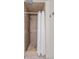 Shower with beige tiles, shower curtain and towel hooks at 4932 N Rhett Ave, North Charleston, SC 29405
