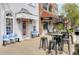 Charming storefronts with outdoor seating and awnings create a welcoming atmosphere for customers at 4932 N Rhett Ave, North Charleston, SC 29405