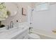 Bright bathroom with subway tile, neutral walls, marble countertop, and decorative vanity mirror at 5 1/2 Kracke St # A, Charleston, SC 29403