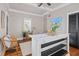 Bright dining area features a marble countertop, wicker chairs, and beach-themed decor at 5 1/2 Kracke St # A, Charleston, SC 29403