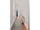 Hallway showcasing hardwood floors, fresh paint, and a vintage accent rug at 5 1/2 Kracke St # A, Charleston, SC 29403