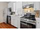 Modern kitchen featuring stainless steel appliances and white marble countertops at 5 1/2 Kracke St # A, Charleston, SC 29403