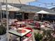 Outdoor seating area with colorful tables and chairs, perfect for enjoying a meal at 5 1/2 Kracke St # A, Charleston, SC 29403