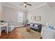 Comfortable sitting room with stylish furnishings, natural light, and hardwood flooring at 5 1/2 Kracke St # A, Charleston, SC 29403