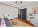 Bright sitting room features neutral decor, hardwood floors, and decorative artwork at 5 1/2 Kracke St # A, Charleston, SC 29403