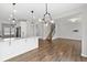 Spacious living area with an open floor plan, hardwood floors, and plenty of natural light at 525 Purple Finch Rd, Summerville, SC 29486