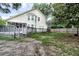 View of backyard and back of house with deck, green grass, and surrounding trees at 5359 Curtisston Ct, North Charleston, SC 29418
