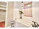 Bright bathroom featuring a luxurious soaking tub, shiplap walls, and modern lighting at 5359 Curtisston Ct, North Charleston, SC 29418