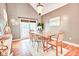 Dining room featuring a wood table with seating for six, modern light fixture and sliding door access to patio at 5359 Curtisston Ct, North Charleston, SC 29418
