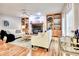 Comfortable living room with hardwood floors, built-in shelving, fireplace and large windows providing natural light at 5359 Curtisston Ct, North Charleston, SC 29418