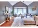 Cozy living room featuring vaulted ceilings, a large sectional sofa, and bright windows for natural light at 5359 Curtisston Ct, North Charleston, SC 29418