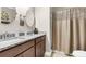 Bathroom featuring double sinks with granite counters and a shower with tan shower curtain at 5509 Alpine Dr, Summerville, SC 29483
