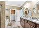 Bright bathroom featuring double sinks, walk-in closet, soaking tub, and lots of light at 5509 Alpine Dr, Summerville, SC 29483