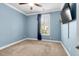 Cozy bedroom with light blue walls, carpeted floors, and a ceiling fan, offering a comfortable retreat at 5509 Alpine Dr, Summerville, SC 29483