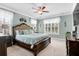 Inviting bedroom with a large bed, neutral carpet, ceiling fan, and soft, natural light at 5509 Alpine Dr, Summerville, SC 29483