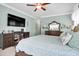 Airy bedroom featuring a large dresser and flatscreen TV and a ceiling fan at 5509 Alpine Dr, Summerville, SC 29483