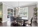 Dining room features a contemporary chandelier and a large window with lots of natural light at 5509 Alpine Dr, Summerville, SC 29483
