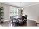 Dining room features a contemporary chandelier, wainscoting, and a large window with lots of natural light at 5509 Alpine Dr, Summerville, SC 29483