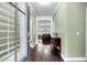 Entryway showcasing hardwood floors, a decorative table, and an open view to the living room at 5509 Alpine Dr, Summerville, SC 29483