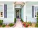 Front entrance featuring beautiful landscaping, a welcome mat, and the house number at 5509 Alpine Dr, Summerville, SC 29483