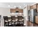 Modern kitchen features a center island with bar seating, stainless steel appliances, and pendant lighting at 5509 Alpine Dr, Summerville, SC 29483