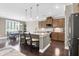Modern kitchen features a center island with bar seating, stainless steel appliances, and pendant lighting at 5509 Alpine Dr, Summerville, SC 29483