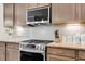 Kitchen features stainless steel appliances, granite countertops, and under-cabinet lighting at 5509 Alpine Dr, Summerville, SC 29483