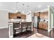 Modern kitchen features a center island with bar seating, stainless steel appliances, and pendant lighting at 5509 Alpine Dr, Summerville, SC 29483