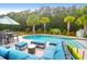 Relaxing poolside lounge area with comfortable seating and tropical plants at 5509 Alpine Dr, Summerville, SC 29483