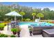 Backyard pool area featuring outdoor seating, lush landscaping, and a relaxing atmosphere at 5509 Alpine Dr, Summerville, SC 29483