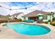 Enjoy outdoor living with a private in-ground pool and a cozy seating area at 5509 Alpine Dr, Summerville, SC 29483
