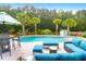 Backyard pool area featuring outdoor seating, lush landscaping, and a relaxing atmosphere at 5509 Alpine Dr, Summerville, SC 29483