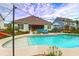Well-maintained backyard pool area with decorative plants and patio seating at 5509 Alpine Dr, Summerville, SC 29483