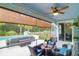Relaxing outdoor porch with ceiling fan, stylish furniture, and a view of the swimming pool at 5509 Alpine Dr, Summerville, SC 29483