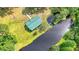 Captivating aerial view of home with pond, manicured lawn, private dock, and lush greenery at 5519 Jefferies Hwy, Walterboro, SC 29488