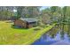 Picturesque exterior view of a cozy home set on a large lot with a tranquil pond at 5519 Jefferies Hwy, Walterboro, SC 29488