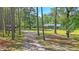 Charming home with well-manicured lawn, tree-lined driveway, and a peaceful country setting at 5519 Jefferies Hwy, Walterboro, SC 29488